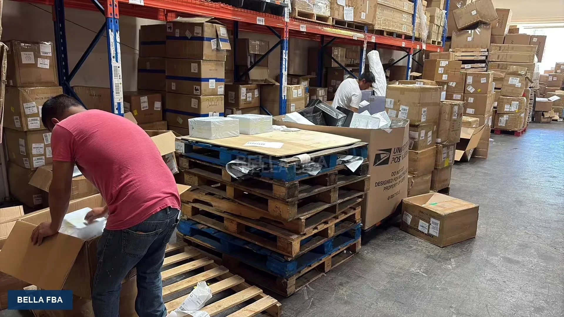 Workers handling palletized inventory inside the U.S. warehouse